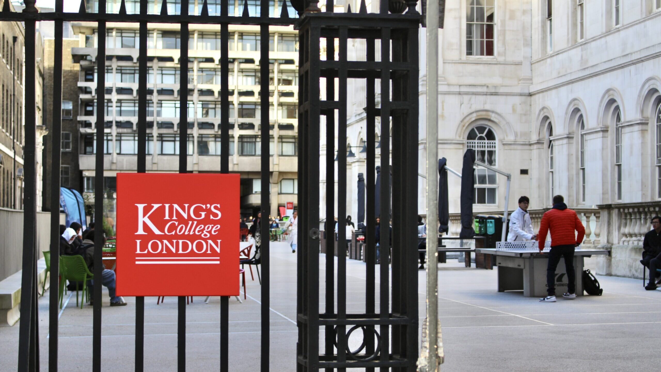 Picture showing King's College London Strand Campus gates with the KCL logo.