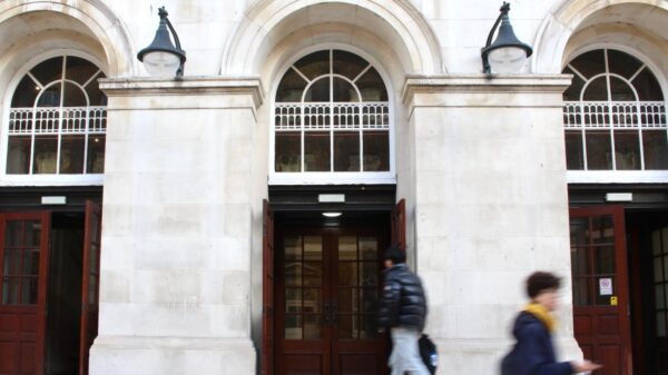 People walking past the Strand campus of King's College London