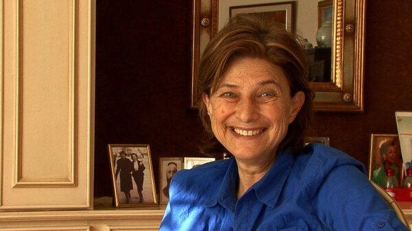 A still of Chantal Akerman smiling from the video Chantal Akerman - Too Far, Too Close