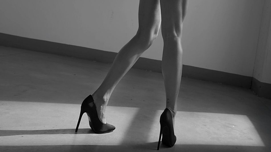 Female legs in high heels in black and white