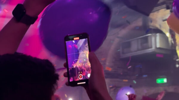 at 'Heaven' nightclub in London, someone films the crowd as balloons fall from the ceiling.