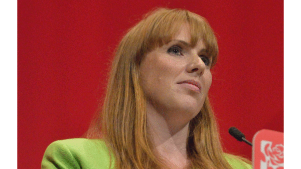 Angela Rayner stands at a podium at the 2016 Labour Party Conference.