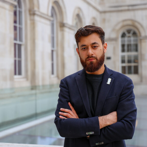 KCLSU president Luqmaan Waqar with folded arms