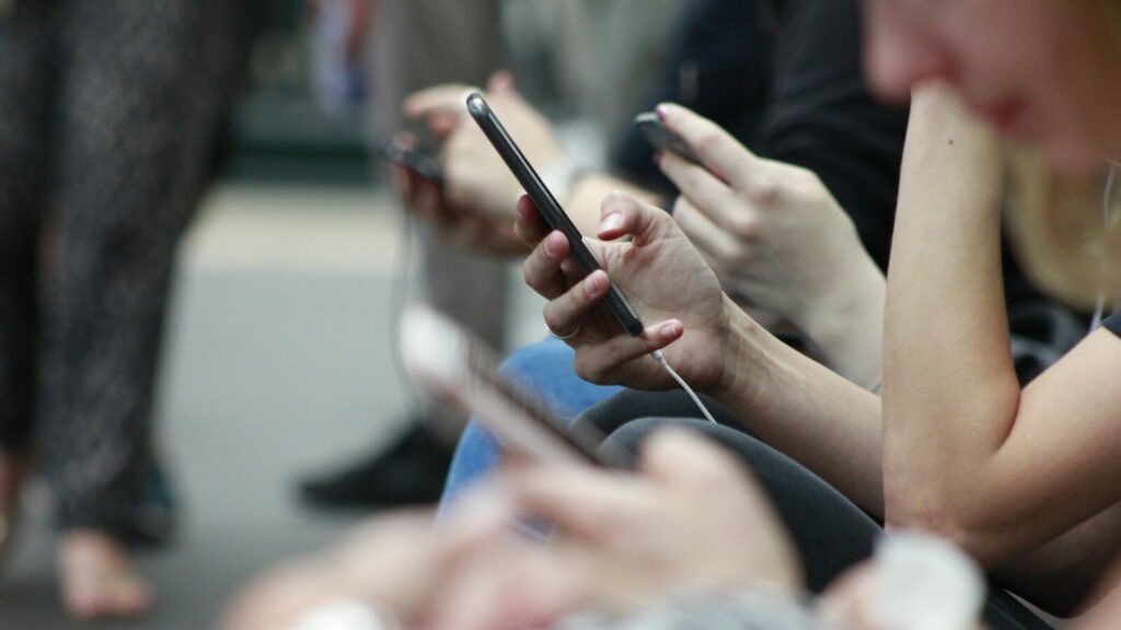 person holding black phone